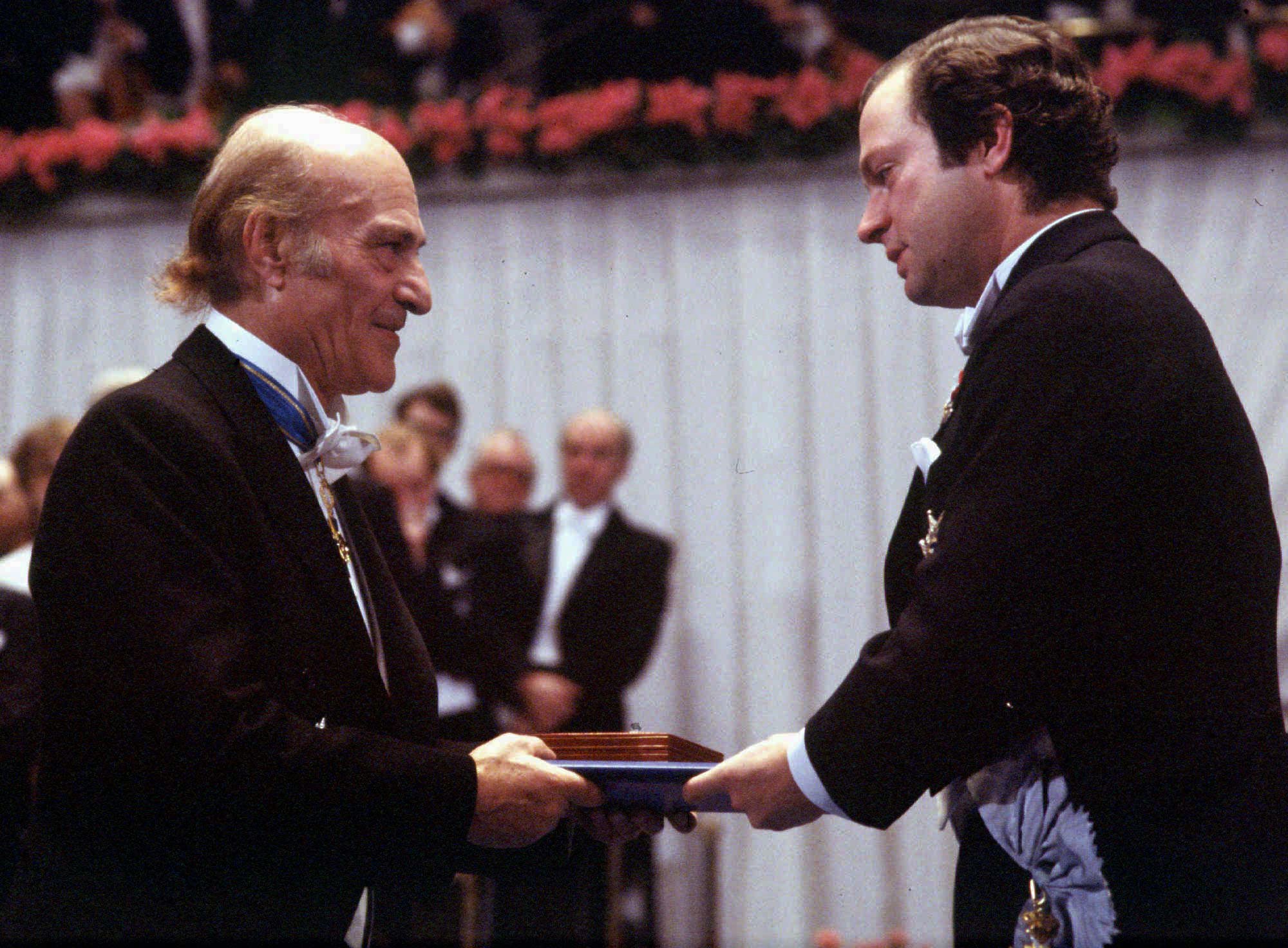 FILE - Greek poet Odysseus Elytis, left, receives the Nobel Prize for Literature from Swedish King Carl XVI Gustaf in Stockholm, Sweden, in this December 10, 1979 file photo. Elytis, who wrote sensuous lyrics about Greek islands and the nation's turbulent history, died at his Athens home of a heart attack Monday March 18, 1996. He was 84. (AP Photo/fls)